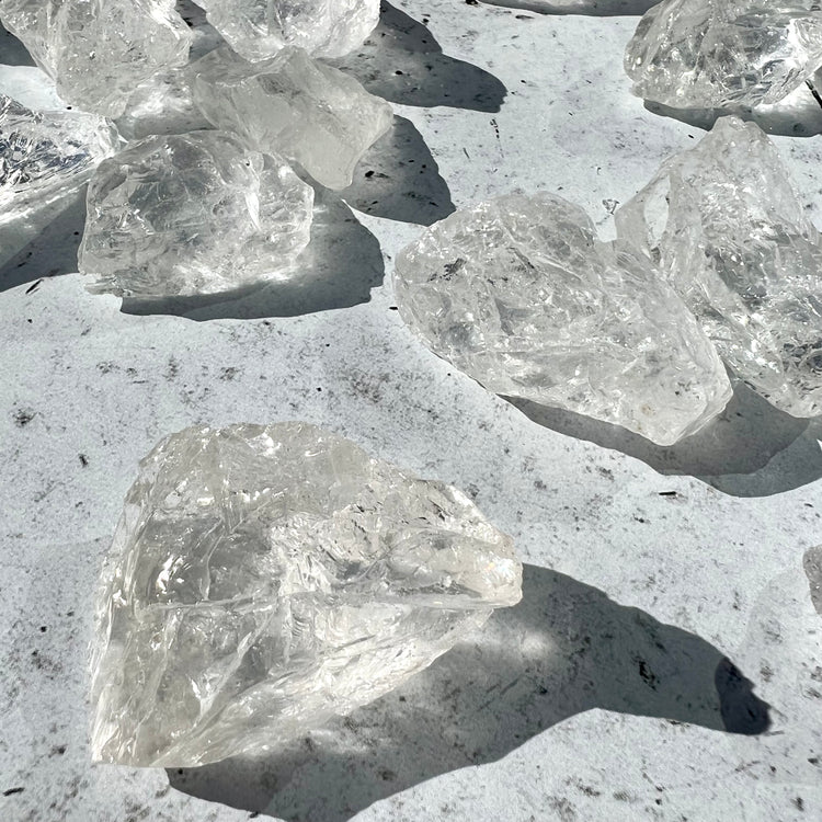 Raw clear quartz chunks glistening in sunshine 